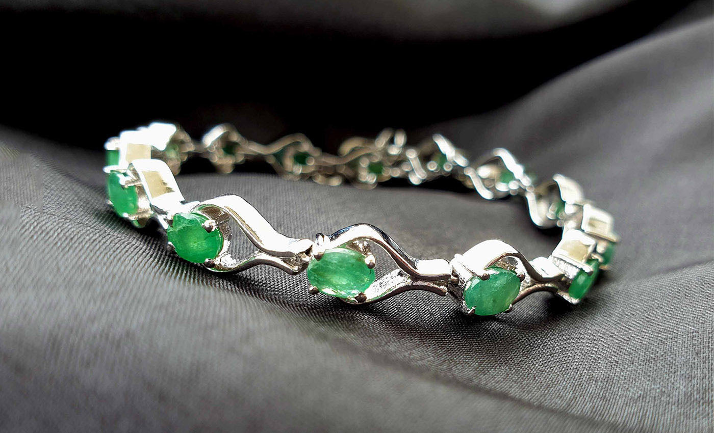 Tennis Bracelet with Emerald and 1 Carat TW of Diamonds in 10kt Yellow Gold
