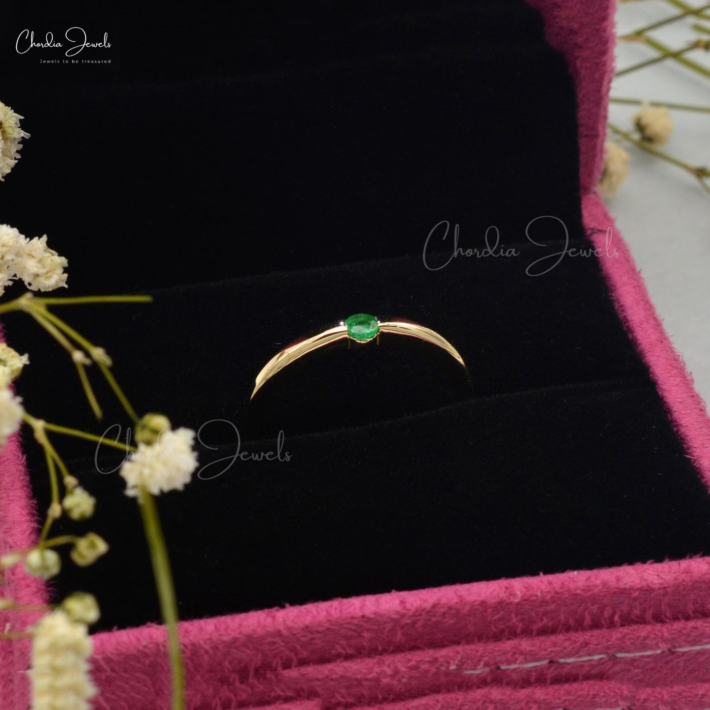 Emerald solitaire ring