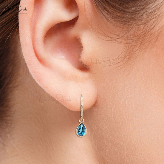 Fascinating oval shaped blue topaz studs