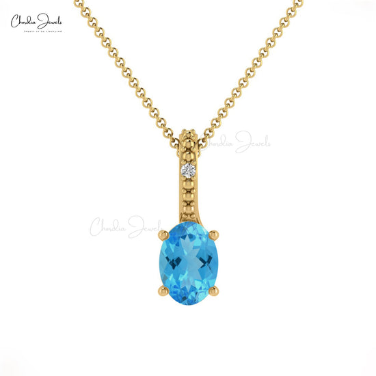 Well Detailed Oval Swiss Blue Topaz & Diamond Pendant in 14K Gold