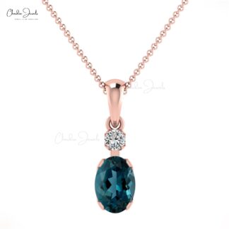Two Stone Prong Set Charms With 0.47 Ct London Blue Topaz And Diamond Pendant