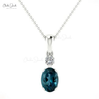 Two Stone Prong Set Charms With 0.47 Ct London Blue Topaz And Diamond Pendant