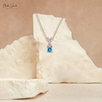 Natural Swiss Blue Topaz & White Diamond Criss Cross Pendant in 14K Gold