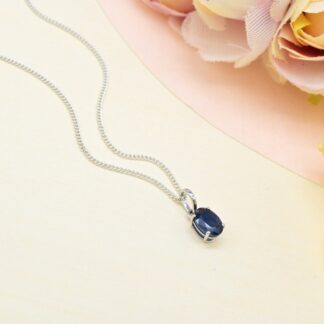 Oval Cut Solitaire Pendant With 7x5mm Blue Sapphire Prong Set In 14k White Gold Necklaces