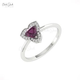 Trillion cut garnet ring with diamond halo