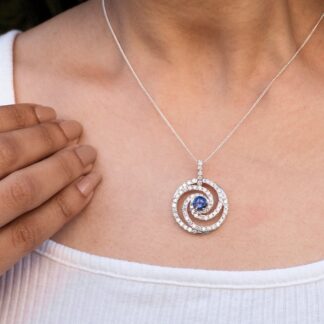 Swirl Diamond Halo Pendant With 6mm Tanzanite Prong Set In 14k White Gold Spiral Pendants